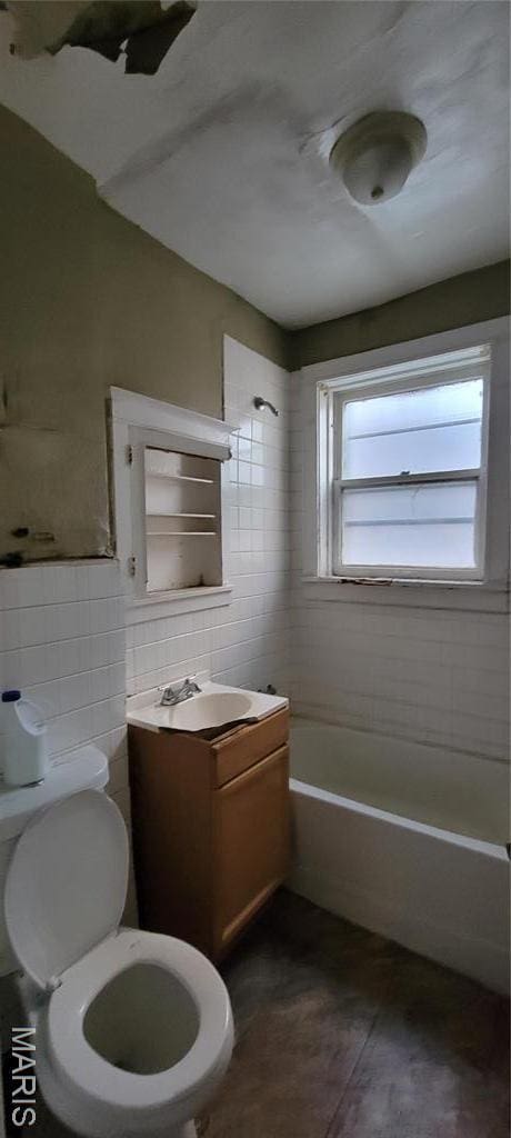 5144 Palm St, Saint Louis, MO 63115 - full bathroom with tile walls, toilet, tub / shower combination, tile patterned flooring, and vanity