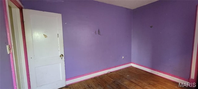 5144 Palm St, Saint Louis, MO 63115 - unfurnished room featuring wood finished floors and baseboards