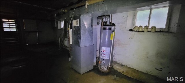 5144 Palm St, Saint Louis, MO 63115 - utility room with gas water heater and heating unit