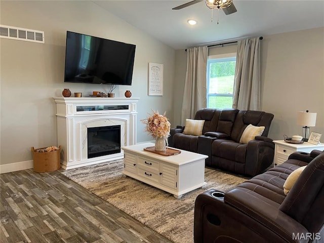 210 Boardwalk Ct, Union, MO 63084 - living area featuring wood finished floors, ceiling fan, lofted ceiling, a glass covered fireplace, and baseboards