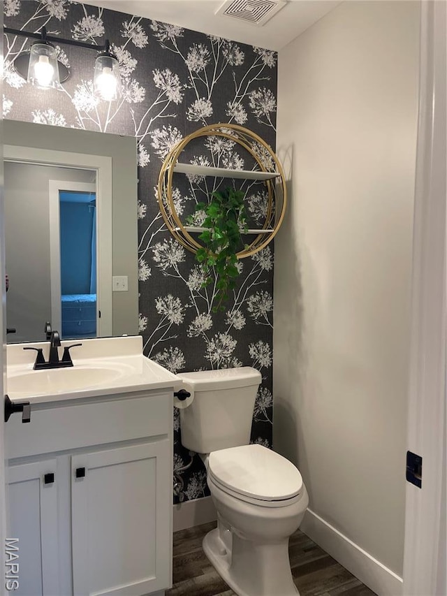 210 Boardwalk Ct, Union, MO 63084 - bathroom with wallpapered walls, wood finished floors, baseboards, vanity, and toilet