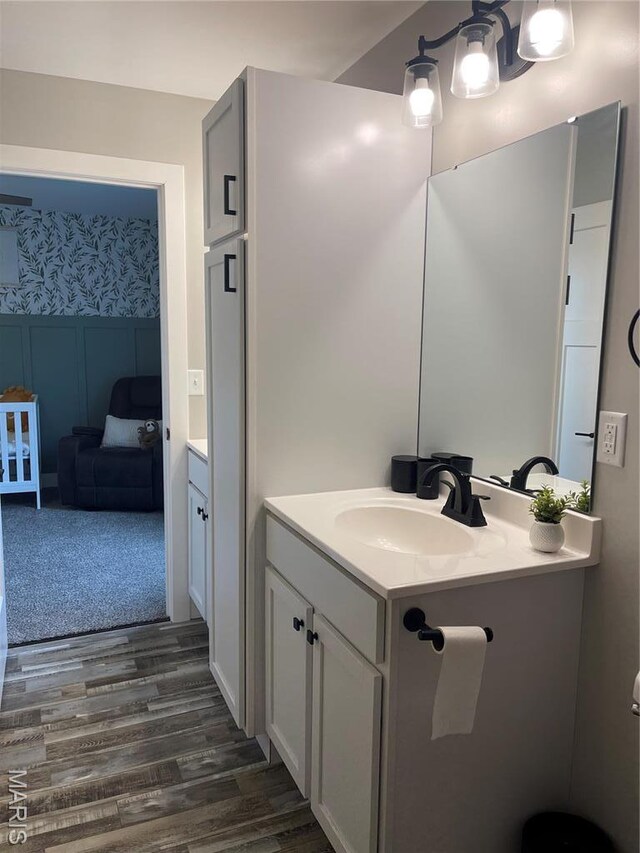 210 Boardwalk Ct, Union, MO 63084 - bathroom with wood finished floors, vanity, and wallpapered walls