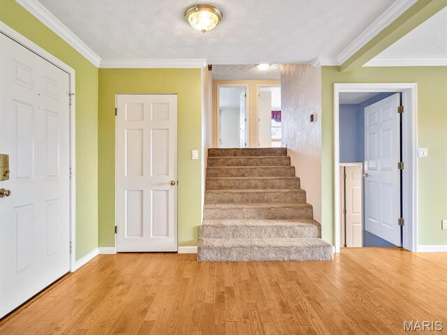 10804 Campbell Rd, Coulterville, IL 62237 - staircase with wood finished floors, baseboards, and crown molding