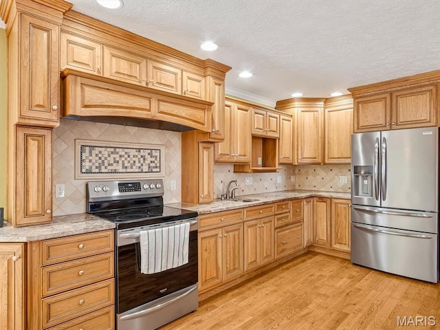 10804 Campbell Rd, Coulterville, IL 62237 - kitchen with stainless steel appliances, backsplash, light wood-style floors, light stone countertops, and a textured ceiling