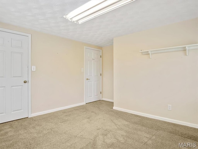 10804 Campbell Rd, Coulterville, IL 62237 - spare room with carpet, baseboards, and a textured ceiling