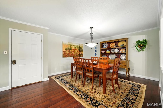 dining space with dark wood-type flooring, ornamental molding, and baseboards