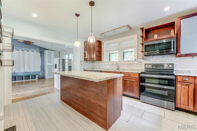 kitchen featuring stainless steel appliances, open shelves, tasteful backsplash, a center island, and decorative light fixtures