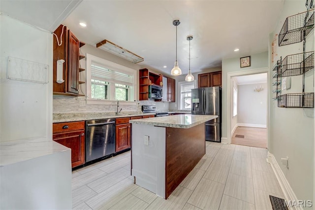 kitchen with stainless steel appliances, open shelves, a sink, decorative backsplash, and hanging light fixtures