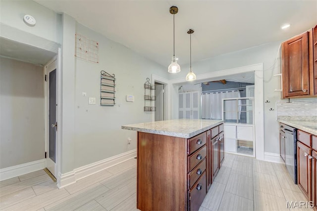 kitchen featuring a kitchen island, decorative light fixtures, dishwasher, decorative backsplash, and baseboards