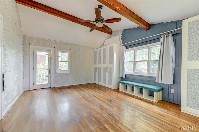 unfurnished living room featuring wood finished floors and ceiling fan