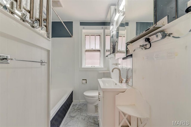 full bath featuring marble finish flooring, toilet, and vanity