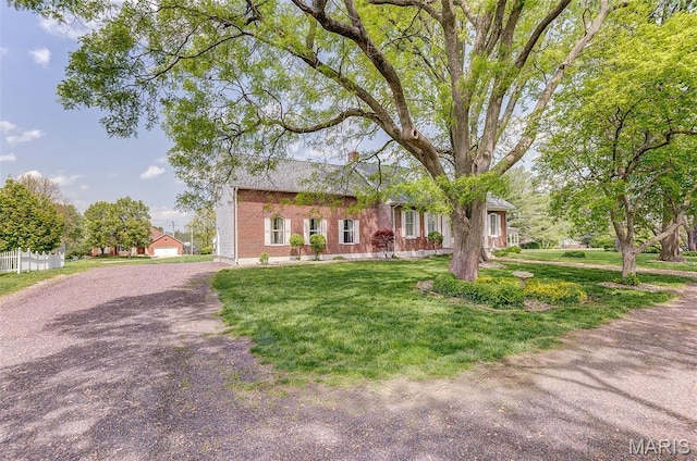 339 E Ml, Millstadt, IL 62260 - view of front facade featuring a front lawn, driveway, and brick siding