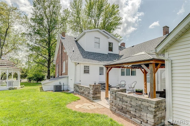 339 E Ml, Millstadt, IL 62260 - back of house featuring a gazebo, a shingled roof, central AC, a lawn, and a chimney