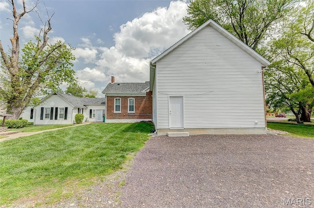 339 E Ml, Millstadt, IL 62260 - view of home's exterior featuring a yard and a chimney