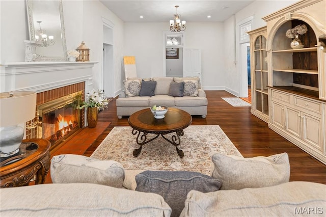 339 E Ml, Millstadt, IL 62260 - living room with a chandelier, wood finished floors, baseboards, and a fireplace