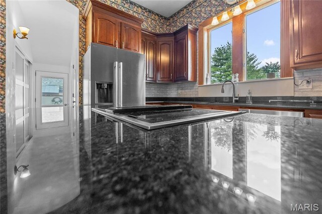 339 E Ml, Millstadt, IL 62260 - kitchen with plenty of natural light, stainless steel refrigerator with ice dispenser, tasteful backsplash, and dark stone countertops