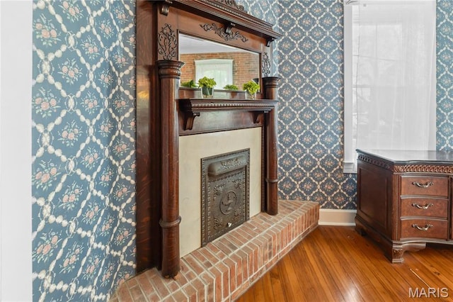 339 E Ml, Millstadt, IL 62260 - detailed view of wallpapered walls, baseboards, and wood finished floors