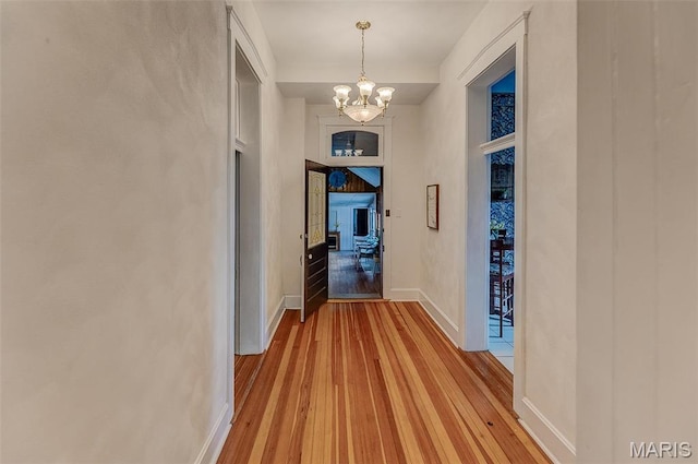 339 E Ml, Millstadt, IL 62260 - corridor with a chandelier, light wood-style floors, and baseboards