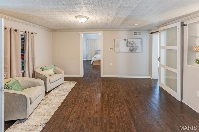 339 E Ml, Millstadt, IL 62260 - living area featuring dark wood-style floors, ornamental molding, and baseboards
