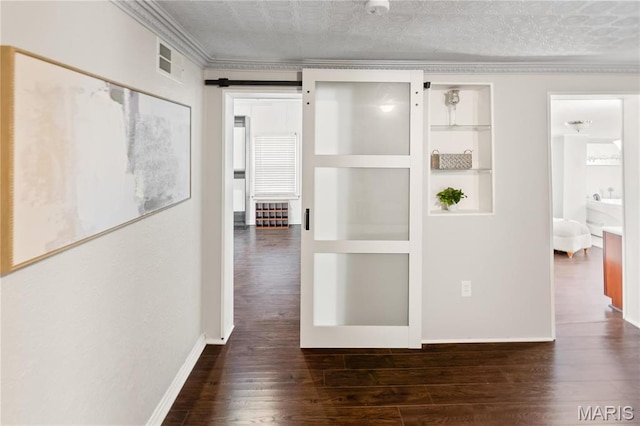 339 E Ml, Millstadt, IL 62260 - hallway featuring wood finished floors, crown molding, baseboards, built in shelves, and an ornate ceiling
