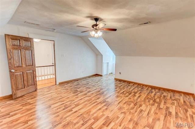 339 E Ml, Millstadt, IL 62260 - additional living space featuring light wood-style flooring, baseboards, ceiling fan, and lofted ceiling
