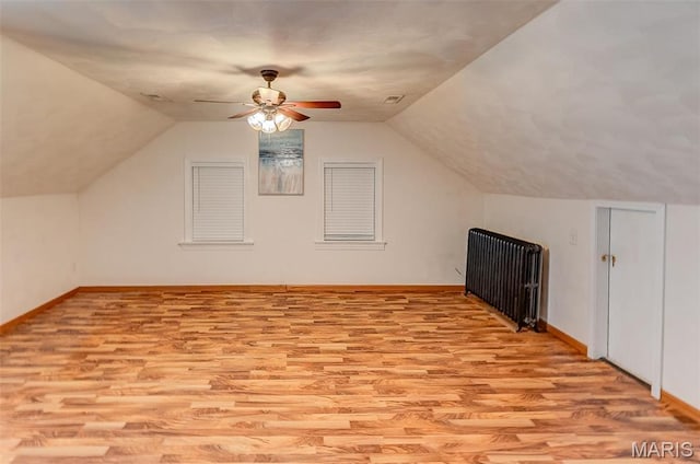 339 E Ml, Millstadt, IL 62260 - additional living space featuring light wood-style floors, ceiling fan, baseboards, and vaulted ceiling