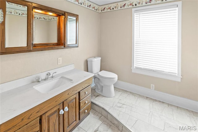 339 E Ml, Millstadt, IL 62260 - bathroom with marble finish floors, baseboards, vanity, toilet, and healthy amount of natural light