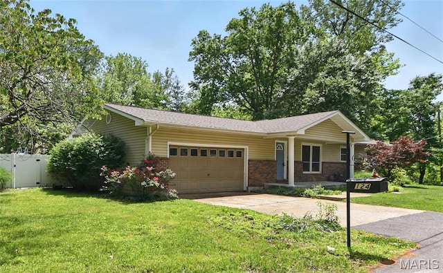 124 Dawn Dr, Washington, MO 63090 - ranch-style home with a garage, brick siding, concrete driveway, and a gate