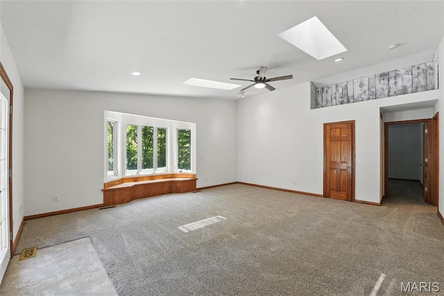 124 Dawn Dr, Washington, MO 63090 - carpeted spare room with a skylight, ceiling fan, baseboards, recessed lighting, and lofted ceiling