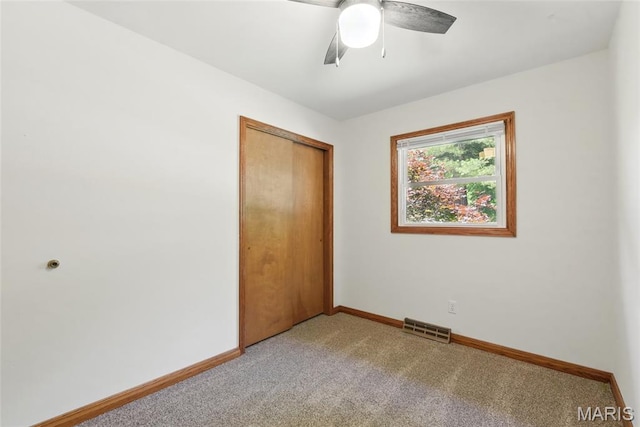 124 Dawn Dr, Washington, MO 63090 - unfurnished bedroom with light colored carpet, a closet, baseboards, and ceiling fan