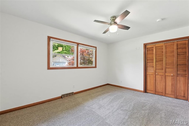 124 Dawn Dr, Washington, MO 63090 - unfurnished bedroom with carpet, baseboards, a closet, and ceiling fan
