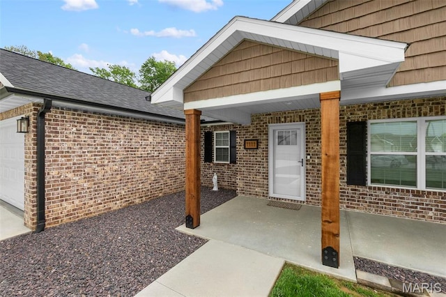 1111 Tulach Ard Ct, Jackson, MO 63755 - doorway to property with brick siding and an attached garage