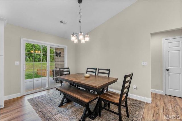 1111 Tulach Ard Ct, Jackson, MO 63755 - dining room featuring light wood-style floors, baseboards, and lofted ceiling