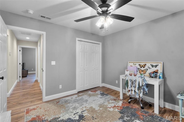 1111 Tulach Ard Ct, Jackson, MO 63755 - office space featuring wood finished floors, ceiling fan, baseboards, and attic access