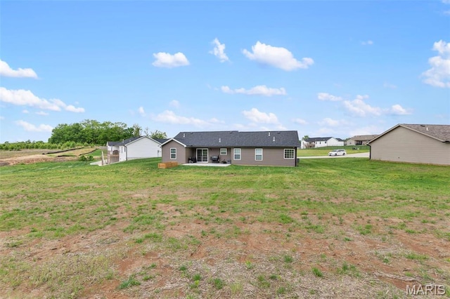 1111 Tulach Ard Ct, Jackson, MO 63755 - rear view of property with a patio area and a lawn