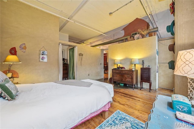 1010 Saint Charles St Unit 701, Saint Louis, MO 63101 - bedroom with wood finished floors