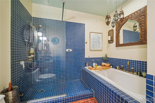 1010 Saint Charles St Unit 701, Saint Louis, MO 63101 - full bathroom featuring a tile shower and a garden tub