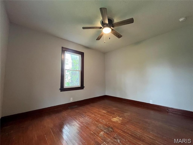 213 W Broadway, Trenton, IL 62293 - unfurnished room with hardwood / wood-style flooring, baseboards, and ceiling fan
