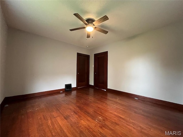 213 W Broadway, Trenton, IL 62293 - unfurnished room with wood finished floors, a ceiling fan, and baseboards