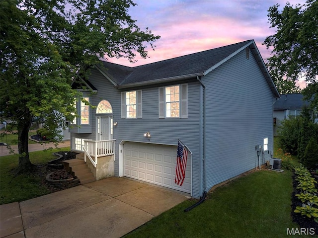 159 Village Circle Dr, Lake St Louis, MO 63367 - raised ranch with driveway, an attached garage, a yard, and roof with shingles