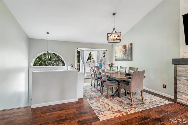 159 Village Circle Dr, Lake St Louis, MO 63367 - dining room featuring a chandelier, wood finished floors, healthy amount of natural light, and high vaulted ceiling
