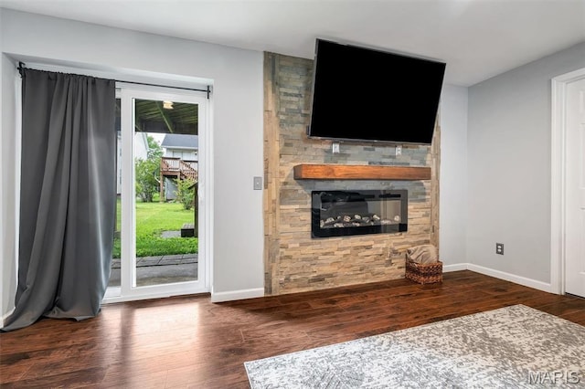 159 Village Circle Dr, Lake St Louis, MO 63367 - unfurnished living room featuring wood finished floors and a stone fireplace