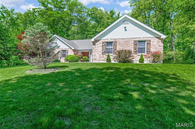 2453 Lone Trail Dr, Foristell, MO 63348 - ranch-style home with a front yard and brick siding