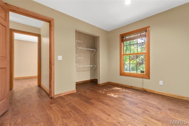 2453 Lone Trail Dr, Foristell, MO 63348 - unfurnished bedroom with wood finished floors, baseboards, a closet, and recessed lighting