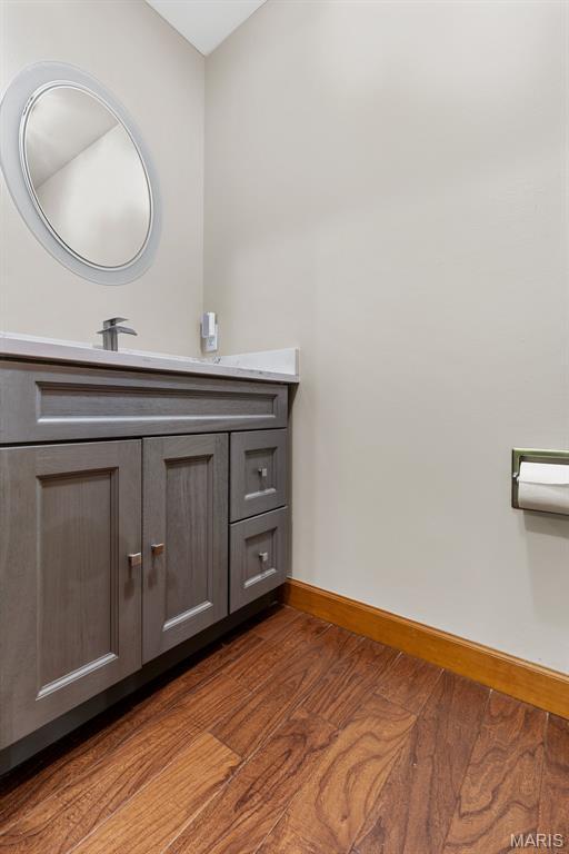 2453 Lone Trail Dr, Foristell, MO 63348 - bathroom with wood finished floors, baseboards, and vanity