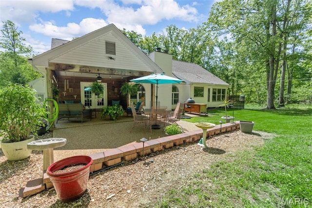 2453 Lone Trail Dr, Foristell, MO 63348 - back of house featuring a patio area, a yard, and a chimney