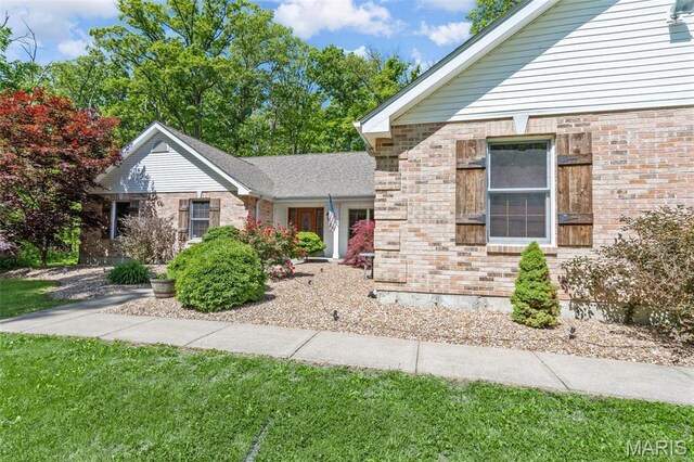 2453 Lone Trail Dr, Foristell, MO 63348 - view of front of home featuring a front yard and brick siding