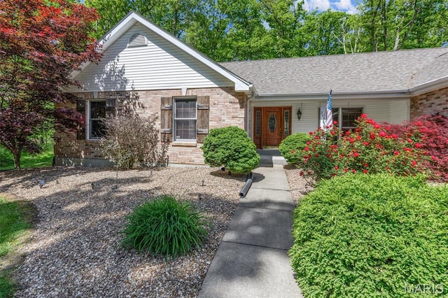 2453 Lone Trail Dr, Foristell, MO 63348 - single story home with brick siding, covered porch, and roof with shingles
