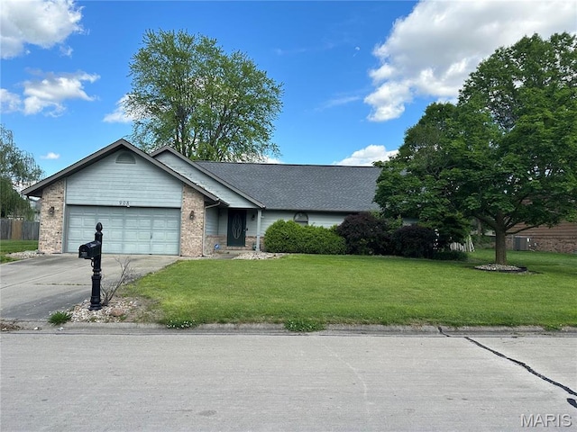view of front facade with concrete driveway, an attached garage, a front yard, and brick siding