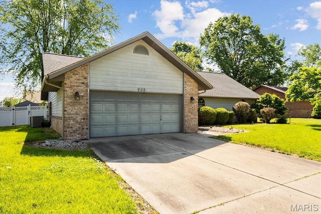 view of front of property featuring brick siding, a garage, driveway, and central AC unit